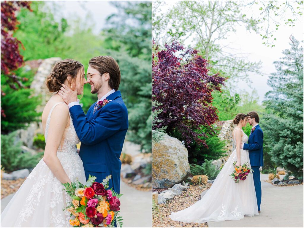 Bride and groom embrace in front of colorful fall trees at waterstone venue wedding in johnson city tennessee