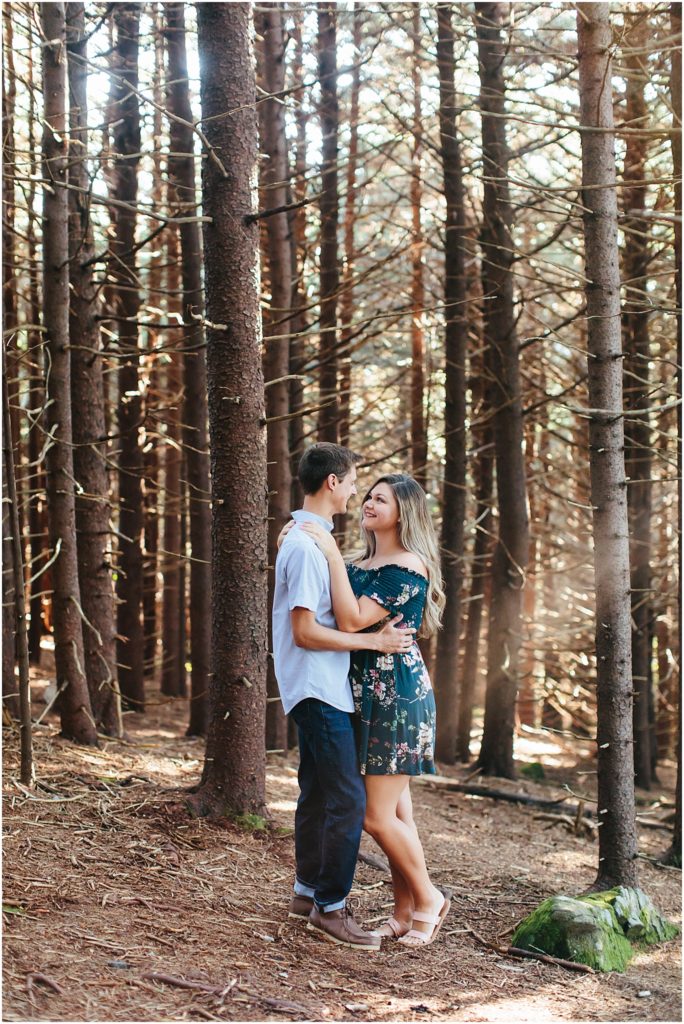 Carvers Gap Roan Mountain Engagement Session couple glancing at each other
