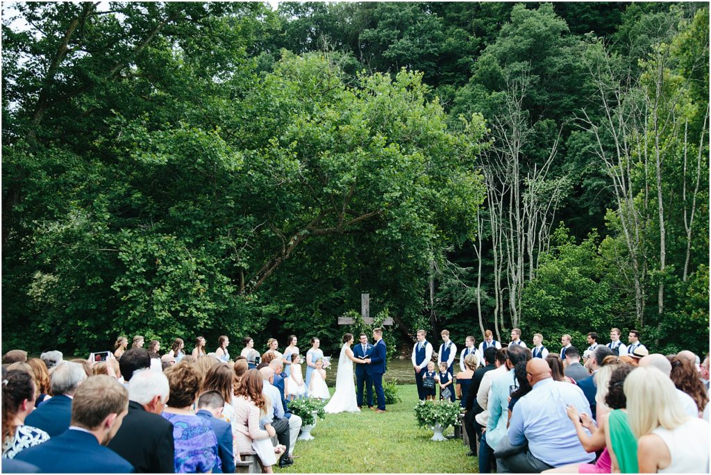 Wide shot of ceremony in front of Crooked River Hiltons, VA