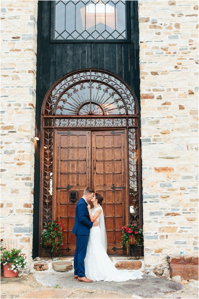 Crooked River Farm venue Hiltons, Virginia photo in front of large wooden door kissing