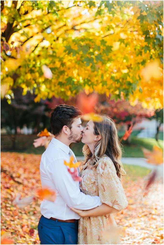 University of Tennessee Knoxville Senior pictures kissing while leaves are falling from above with Bristol Virginia senior photography 