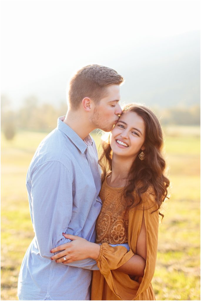 Bristol VA photographer capturing engaged couple kissing during photo shoot