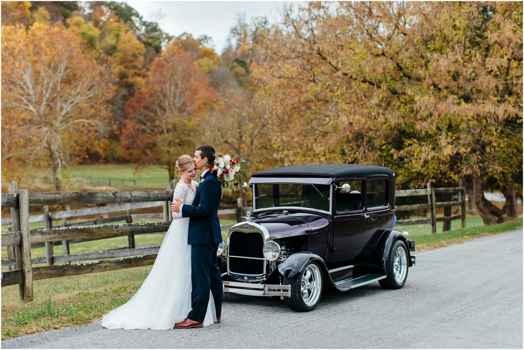 Middle Fork Barn wedding venue photography bride and groom posing in front of vintage car during fall wedding