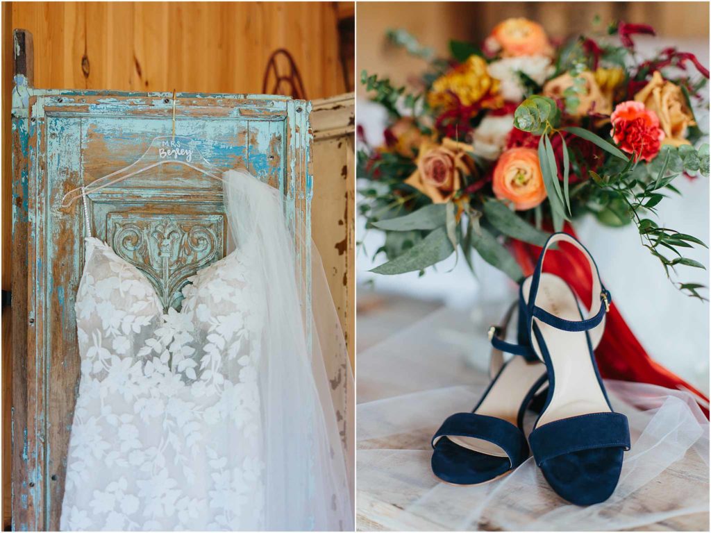 Close in details of wedding dress and bridal shoes hanging on wooden door crooked river wedding venue