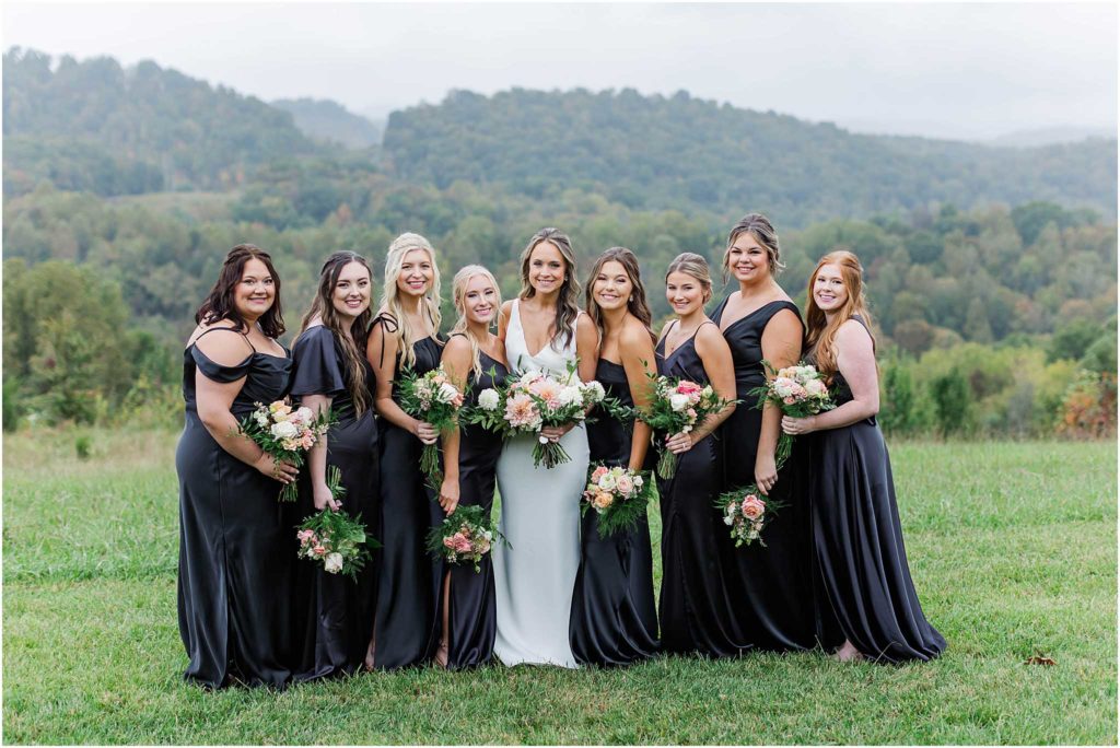 Bride and her bridesmaids in front of mountains at Chateau Selah wedding venue