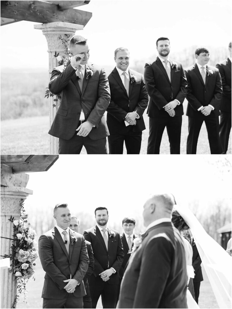 Groom looking on at bride walking down isle with her dad. Black in white photo from bristol tn wedding photographer