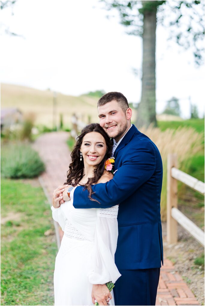 Newlyweds smile at west virginia wedding photographers camera