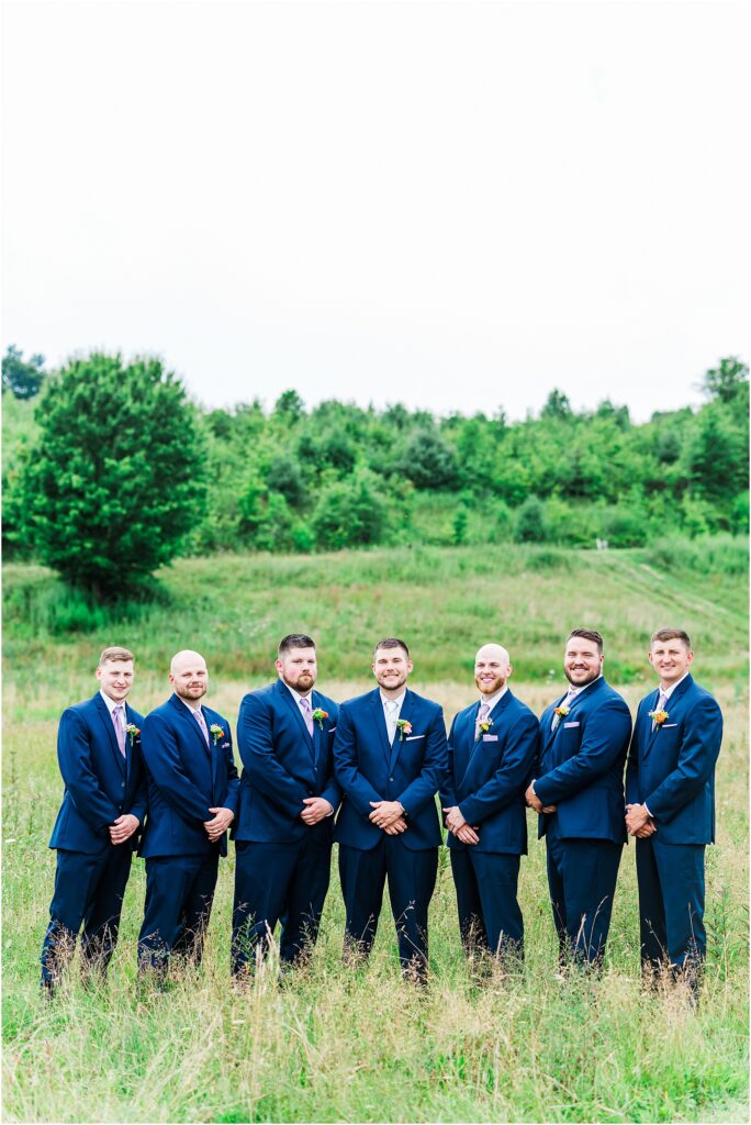 Glade Creek Farm groomsman in front of mountains